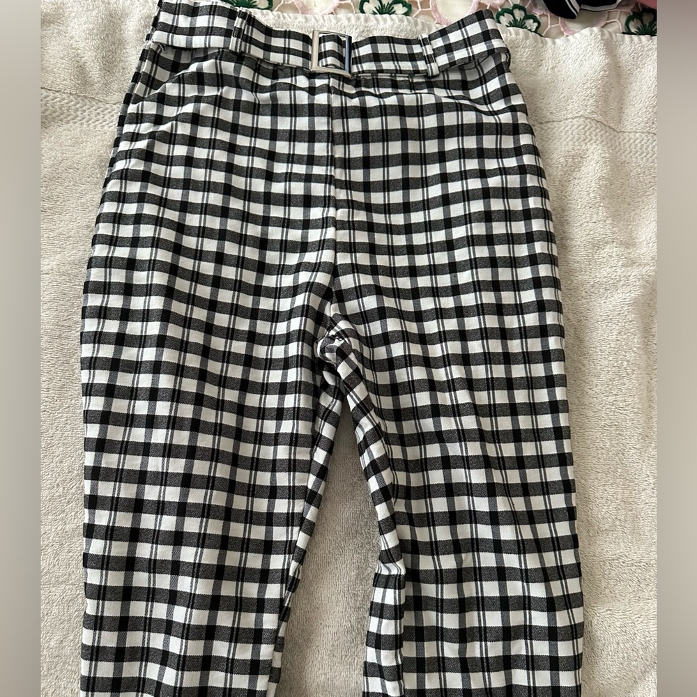 Tight fitting black and white business pants